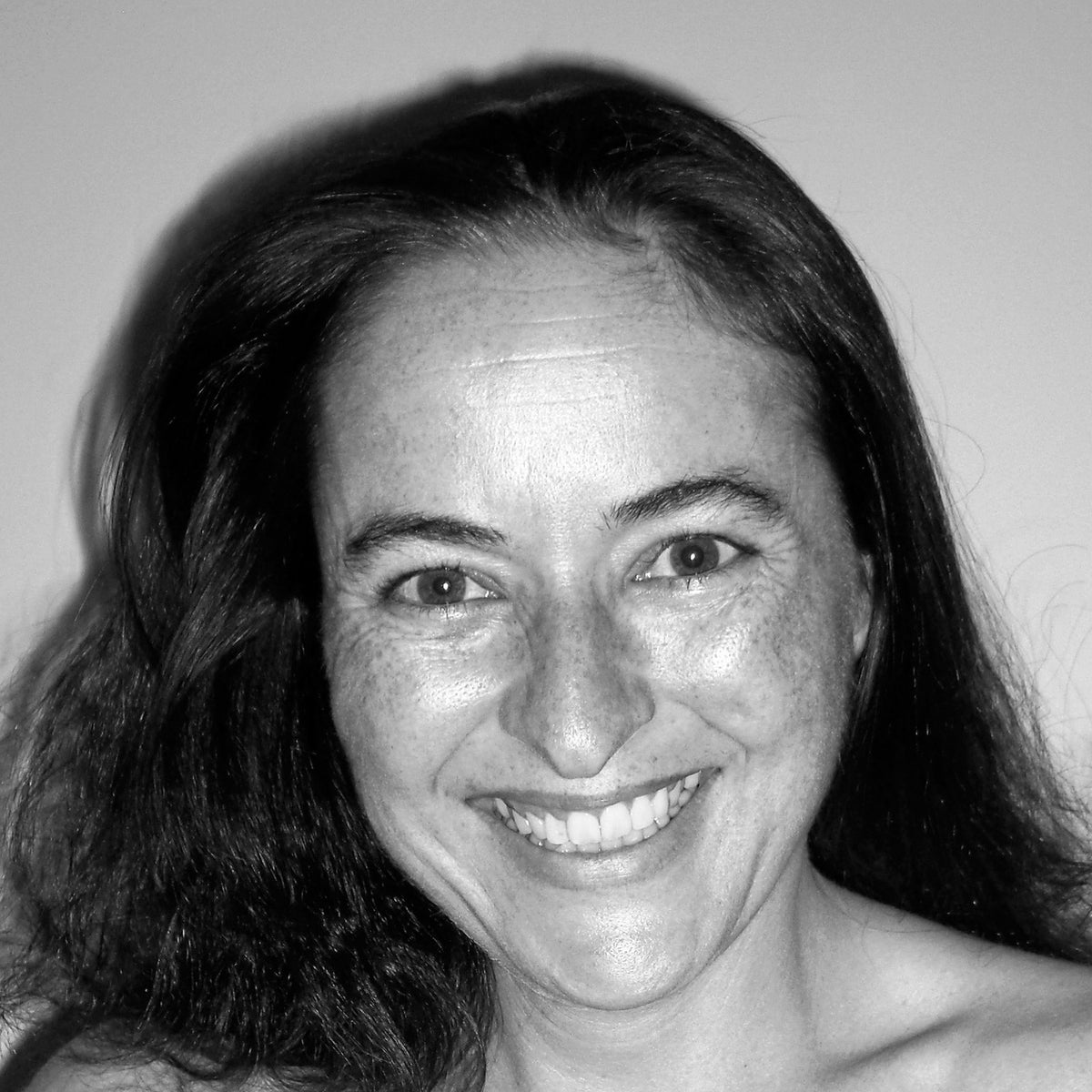 A smiling headshot of me in black&white 